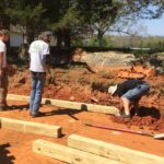 Installing Timber Retaining Wall - Earth Effacts Landscaping